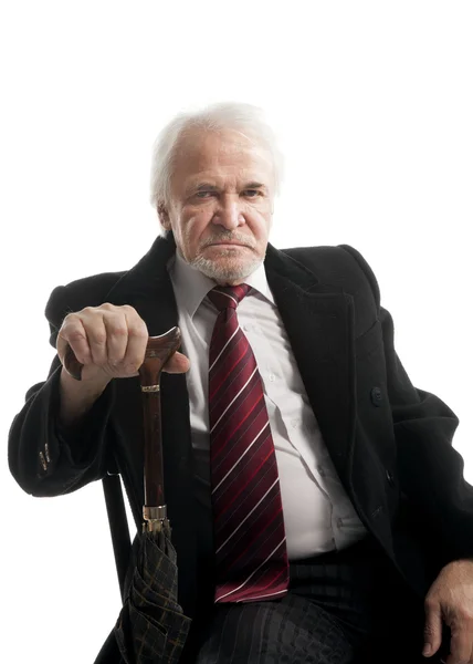 Senior businessman with umbrella — Stock Photo, Image