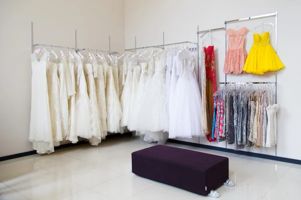 Wedding;  dresses on hangers in store — Stock Photo, Image