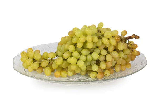 Bunch of green grapes on a glass plate — Stock Photo, Image