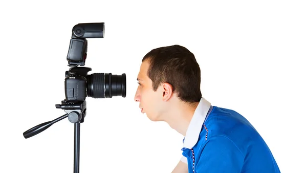 Young man looking into the camera lens — Stock Photo, Image