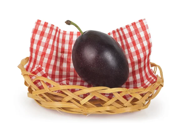One plum in a basket — Stock Photo, Image