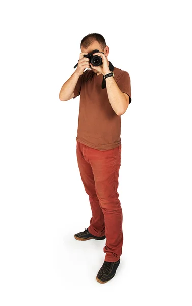 Young man looking into the camera lens — Stock Photo, Image