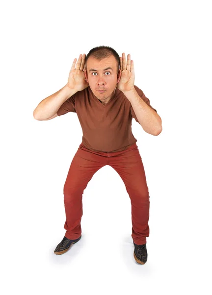 Closeup portrait handsome, young nosy, surprised man hands to ears — Stock Photo, Image