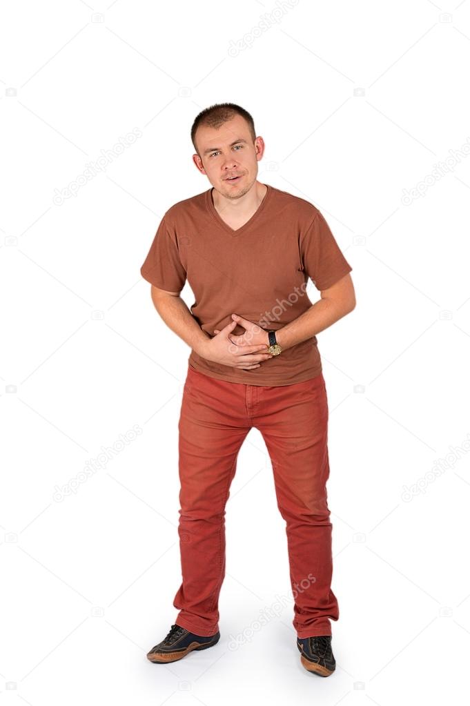 Young man holding his hands on his stomach with pain
