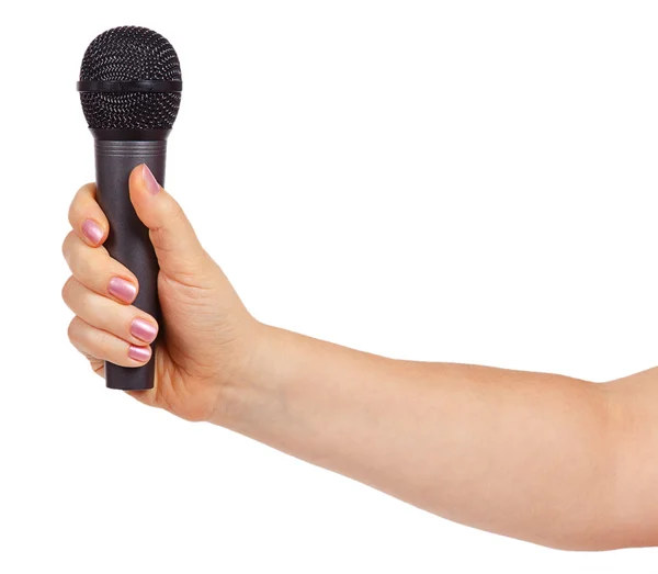 Mão feminina segurando um microfone — Fotografia de Stock