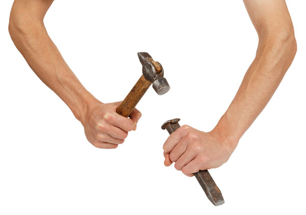 Male hands working with hammer and chisel