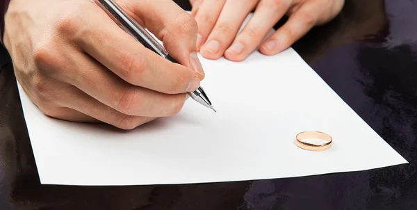 Closeup of male hand signing divorce papers — Stock Photo, Image