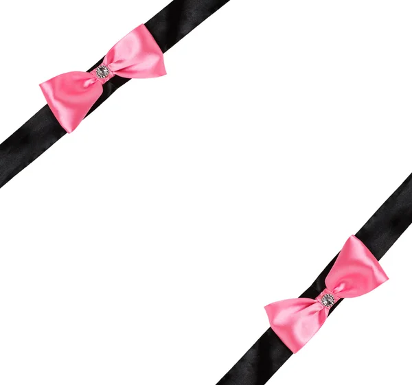 Dos lazo rosa en una cinta negra — Foto de Stock