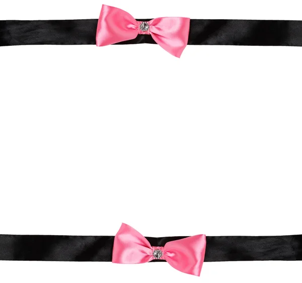 Dos lazo rosa en una cinta negra —  Fotos de Stock