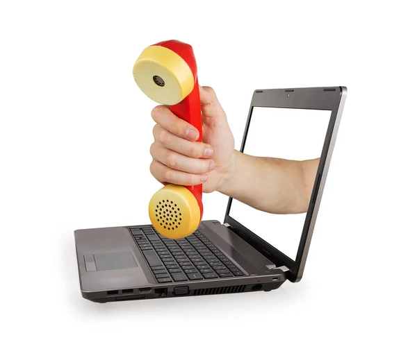 Hand of a laptop holding red telephone — Stock Photo, Image