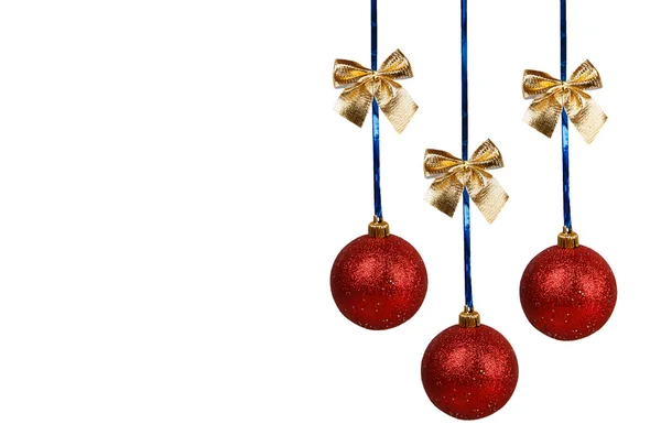 Three red Christmas balls with golden bows — Stock Photo, Image