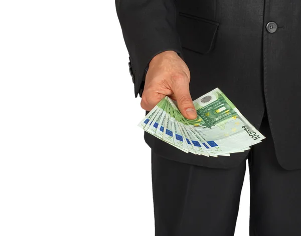 Чоловік у костюмі тримає кілька банкнот євро — стокове фото