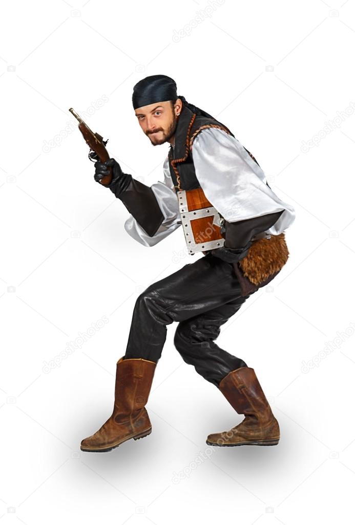 Man dressed as a pirate with a gun and chest