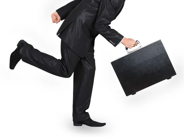 Man in a black suit with a black case running — Stock Photo, Image