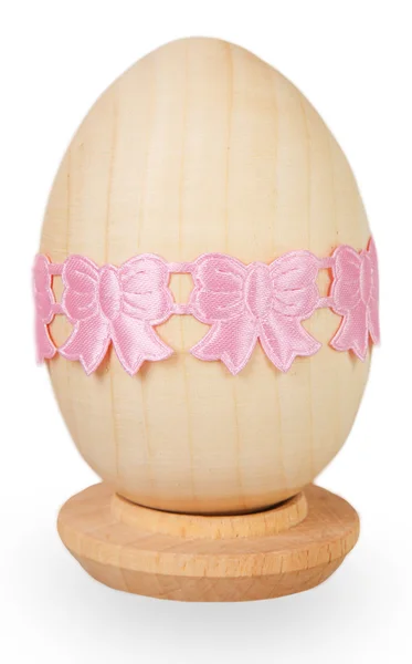 Pink ribbon on wooden egg — Stock Photo, Image