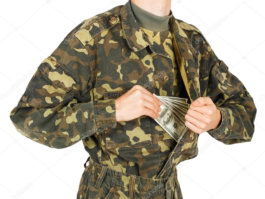 Man in military uniforms pulls money out of his jacket