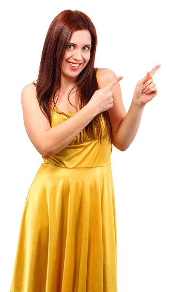 Sarı elbiseli genç gülümseyen kadın işaret parmak somethi gösterilen — Stok fotoğraf
