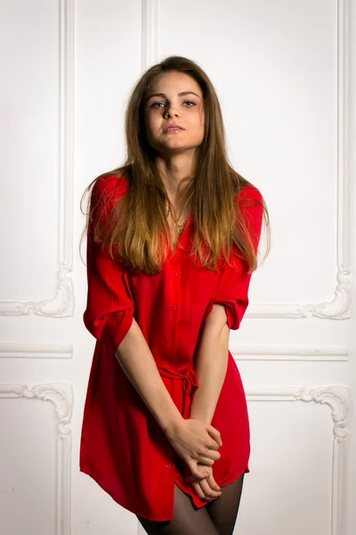 Sexy brunette woman in a red shirt — Stock Photo, Image