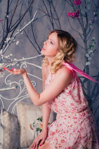 Young beautiful woman in angel costume with pink wings — Stock Photo, Image