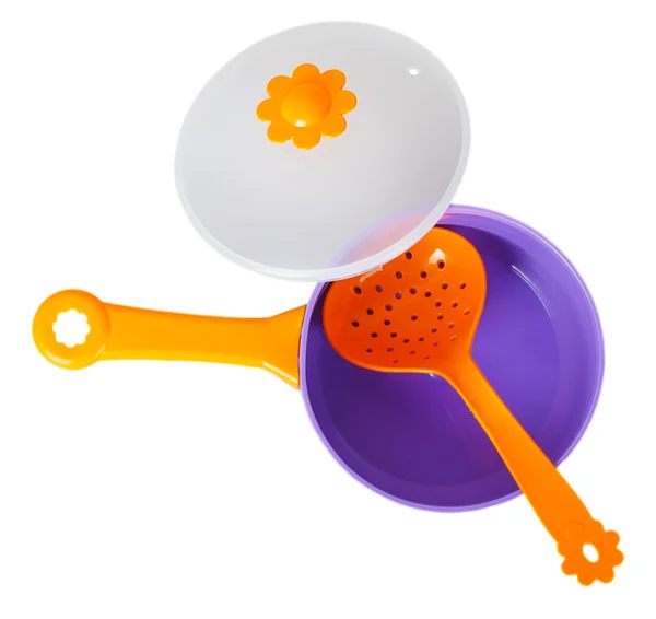 Purple toy pan with orange colander — Stock Photo, Image