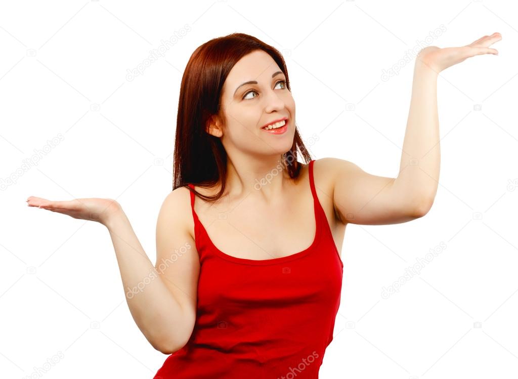 Young woman holding her hands out as if balancing or weighing so