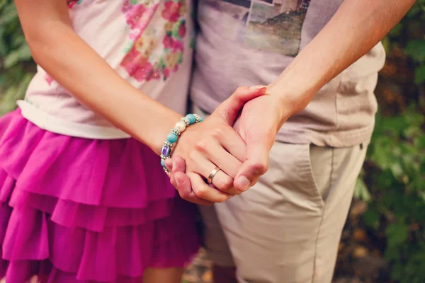 Two pairs of hands in love tenderly hold together — Stock Photo, Image