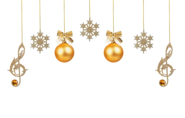 Golden treble clefs, snowflakes and Christmas balls — Stock Photo, Image