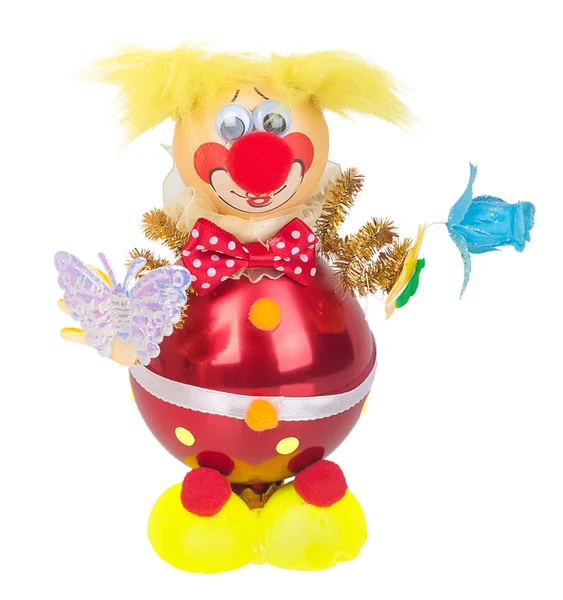 Speelgoed clown met een vlinder en een bloem in de handen decoratie — Stockfoto