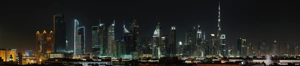 Dubai world trade center en burj khalifa nachts — Stockfoto