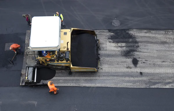 Asphalt spreader in work on site — Stock Photo, Image