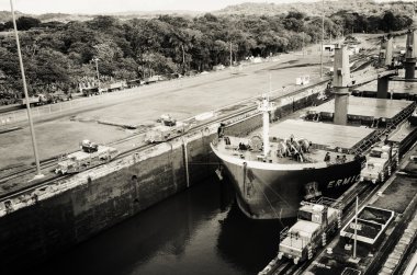 Oil tanker, assisted by tugboats in Panama Canal  clipart
