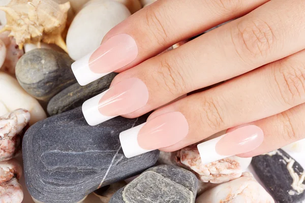 Nails with long artificial french manicure — Stock Photo, Image