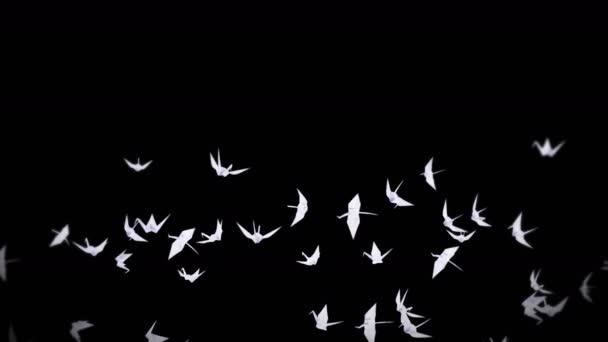 黒を背景に白い折り鶴がたくさん飛んでいます 空気中に浮かぶ美しい折り紙 平和の概念 紙の3Dループアニメーション — ストック動画