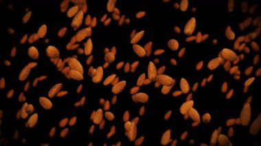 Siyah arka planda bir sürü badem cevizi uçurmak. Yiyecekler, sağlıklı yiyecekler, diyet. Badem dönüşünün 3 boyutlu animasyonu. Döngü canlandırması.