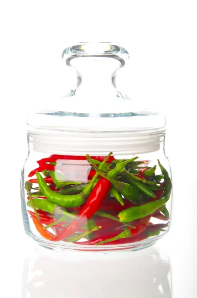 Hot chili peppers in glass bowl — Stock Photo, Image