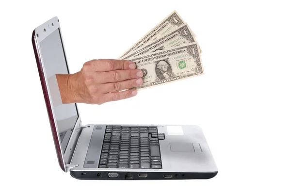 Hand with dollar banknotes comes from the laptop screen — Stock Photo, Image