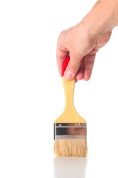 Paint brush in hand — Stock Photo, Image