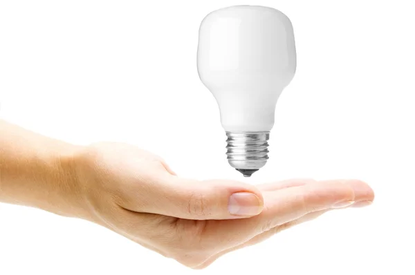 Енергозберігаюча лампа в руці — стокове фото