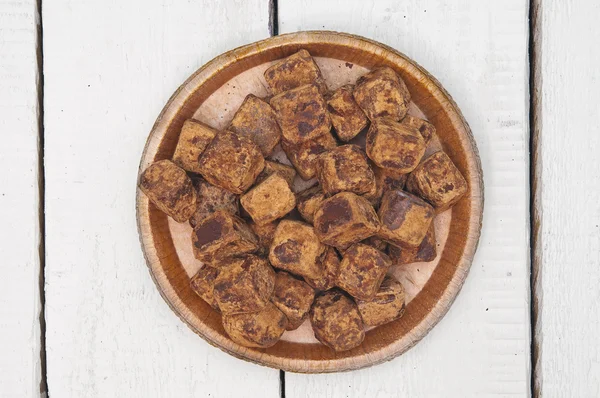 Chocolate truffles on wooden background — Stock Photo, Image