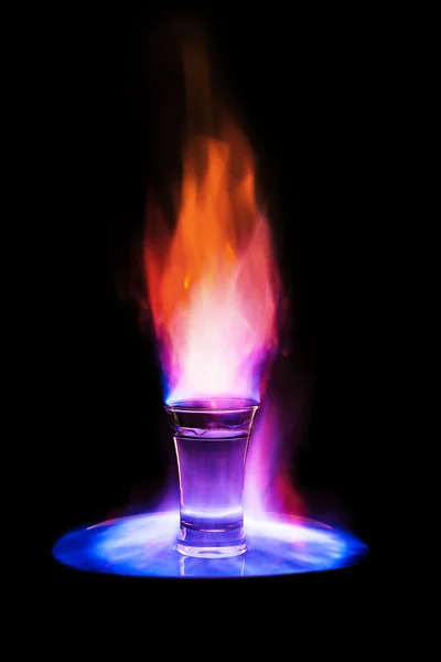 Flaming vodka in glass Royalty Free Stock Photos