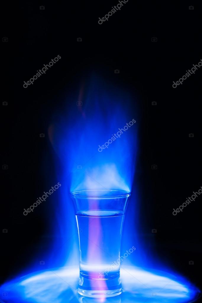 Cocktail burning blue flame Stock Photo by ©lipsky 69929037