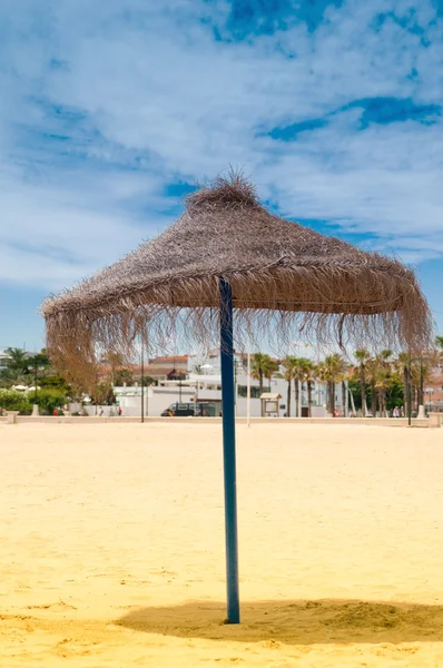 Reed umbrellas on the beach — Stock Photo, Image