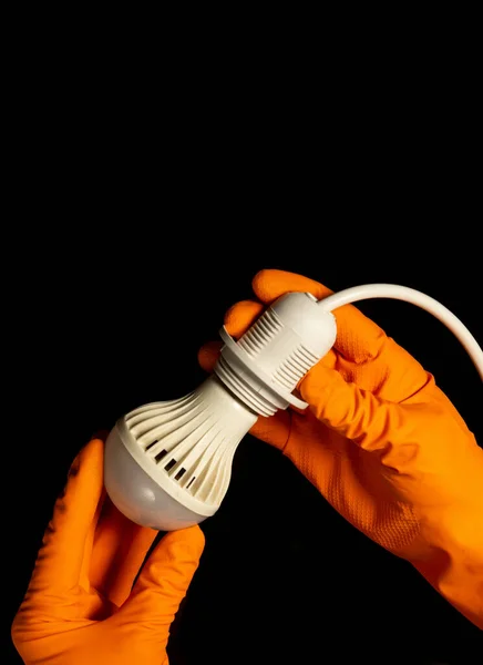 Closeup of a plumber hand connect a brass fitting and high pressure plumbing hose