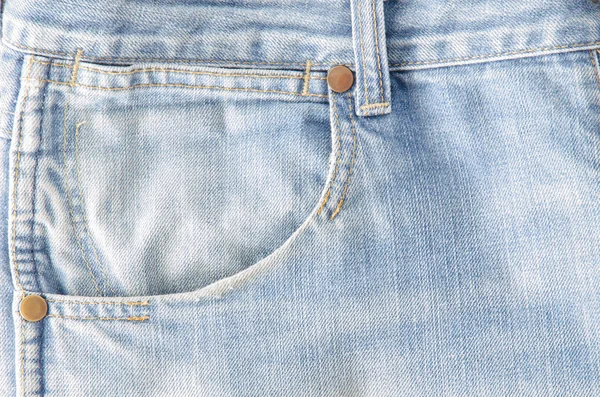 Worn blue denim jeans texture — Stock Photo, Image