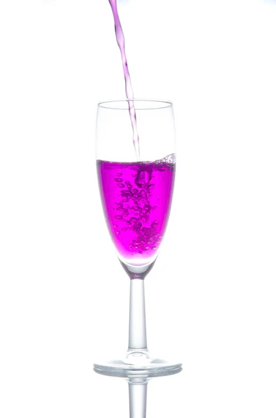 purple cocktail in glass on white background