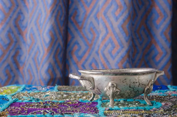 Moroccan metal bowl placed on a table — Stock Photo, Image