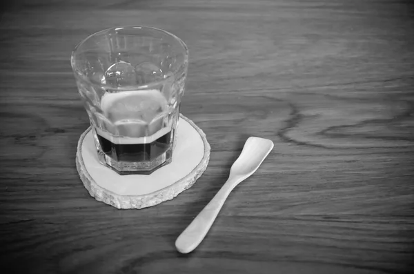 Cup of coffee on wooden table — Stock Photo, Image