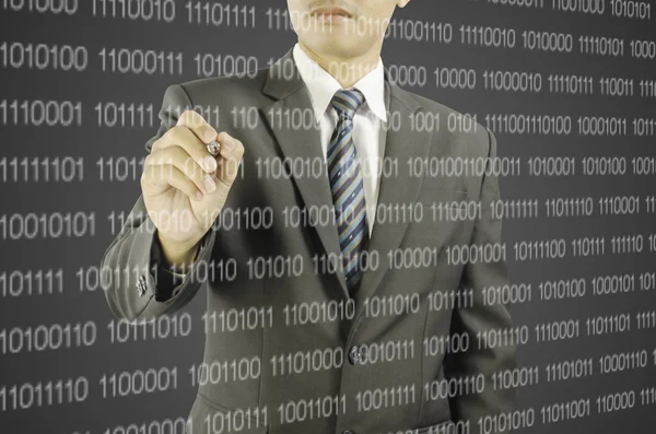 Businessman pointing pen at the digital code — Stock Photo, Image