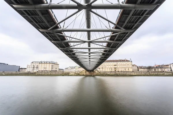 Under the footbridge connecting historic districts Kazimierz and — Stock Photo, Image