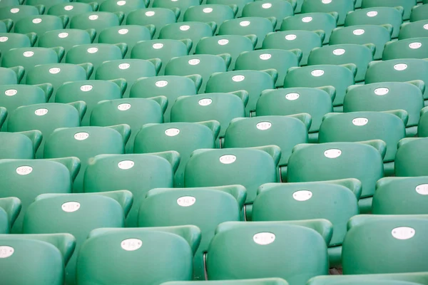 Green plastic seats  at modern stadium — Stock Photo, Image